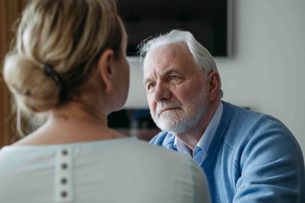 Family members having difficult conversation about grief and inheritance